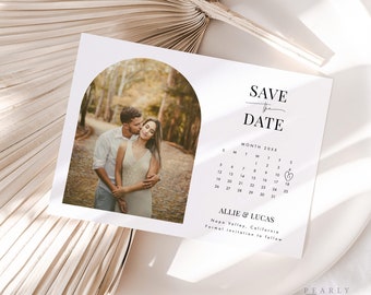 May include: Save the date card featuring a photograph of a couple in a woodland setting. The card includes a calendar with a heart marking the wedding date. The text reads "Save the Date", "Month 20XX", "Allie & Lucas", "Napa Valley, California", and "Formal invitation to follow".