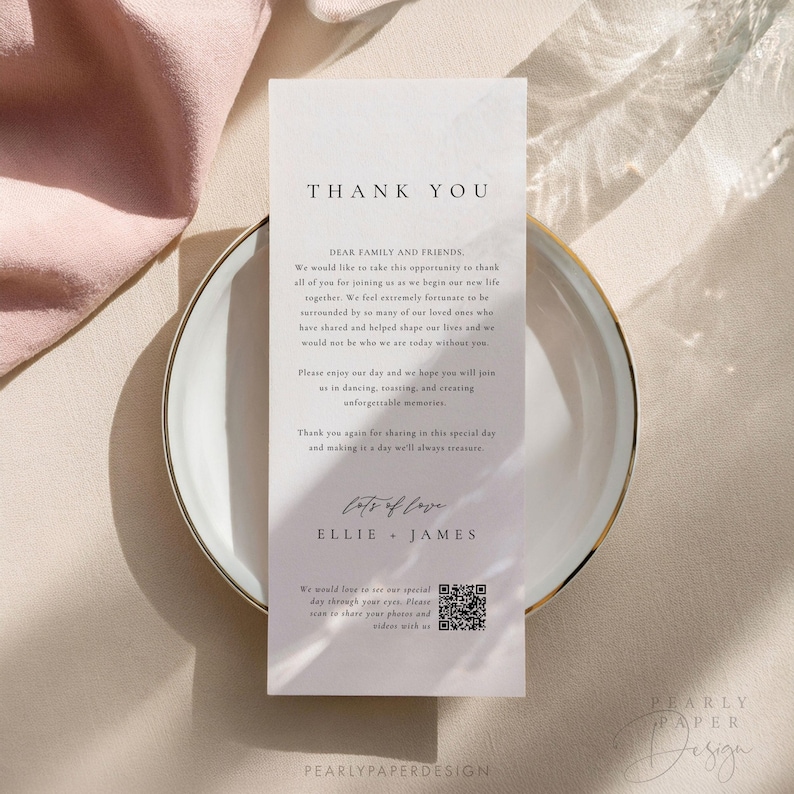 May include: A white thank you card with a marble texture background. The text "Thank You" is in a black font at the top of the card. The text "Dear Family and Friends" is in a black font below the "Thank You" text. The text continues with a message of gratitude for the guests attending the wedding. The text "Lots of Love" is in a cursive font with the names "Ellie & James" below it. A QR code is at the bottom of the card with the text "We would love to see our special day through your eyes. Please scan to share your photos and videos with us."