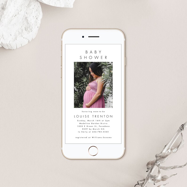 May include: A white smartphone screen displaying a baby shower invitation for Louise Trenton. The invitation includes the date, time, location, and RSVP information. A photo of the expectant mother is featured in the top half of the screen.