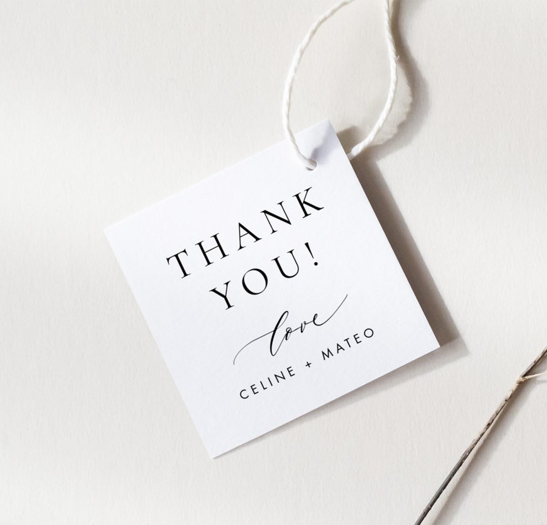 May include: White square thank you tag with black text that reads "Thank You!" and "love Celine + Mateo".
