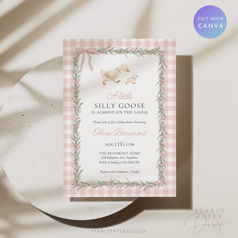 May include: A baby shower invitation with a pink gingham background and a decorative floral border. The invitation features a watercolor illustration of a goose and gosling, with the text "A little silly goose is almost on the loose."