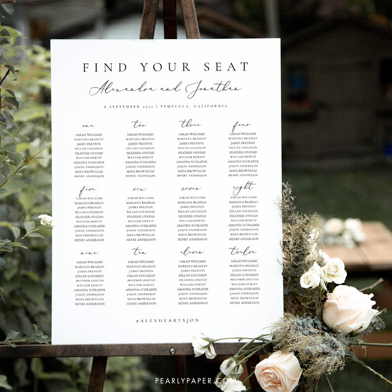 May include: A white seating chart with black text for a wedding reception. The chart is titled "Find Your Seat" and lists the names of guests for each table. The tables are numbered one through twelve. The wedding couple's names are "Alexandre and Jonathan" and the date is September 2017. The text at the bottom of the chart reads "#ALEXHEARTSJON".