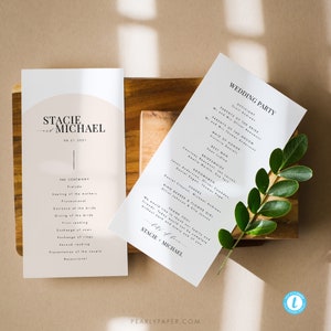 May include: Wedding ceremony program with a minimalist design. The program features the names "Stacie & Michael" and the date "08.21.2021". The program lists the order of events for the ceremony and the wedding party.