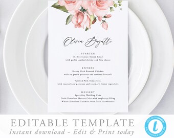 May include: A printable wedding menu template with a floral design featuring pink roses and green leaves. The menu includes the names "Olivia Bugatti" and the menu items: "Mediterranean Tossed Salad", "Honey Herb Roasted Chicken", "Grilled Pork Tenderloin", "Speciality Wedding Cake", "Dark Chocolate Mousse Cake", and "White Chocolate Tiramisu".