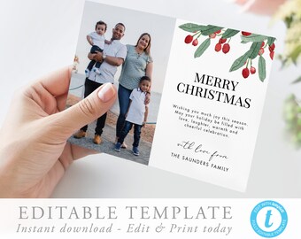 May include: A Christmas card template featuring a family photo with a festive watercolor illustration of red berries and green leaves. The text reads "Merry Christmas" and "with love from The Saunders Family".