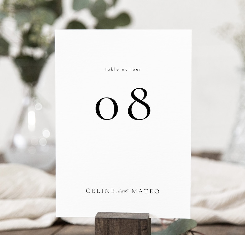 May include: White table number card with black text. The card reads "table number 08" and "CELINE and MATEO".
