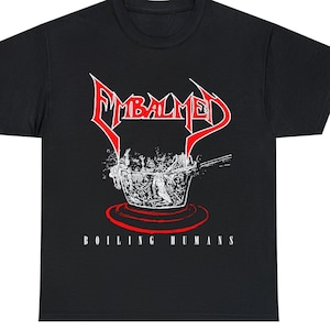 May include: Black t-shirt with a red "EMBALMED" logo and a white image of a pot with people inside. The text "BOILING HUMANS" is printed below the image.