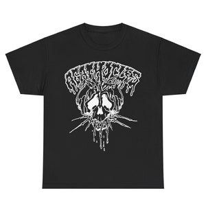 May include: Black t-shirt with a white graphic of a skull with dripping blood and the text "AGITATOR" above it.