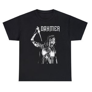 May include: Black t-shirt with a white graphic print of a woman holding a knife and the text "DAHMER" above her.