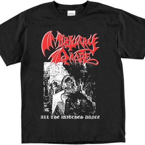 May include: Black t-shirt with a white and red graphic print of a band logo. The logo says "Misery Index" in red with a white winged demon behind it. The text "All the Witches Dance" is printed below the logo.