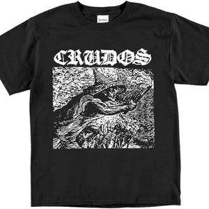 May include: Black t-shirt with a white graphic print of a band logo, "CRUIDOS", and a stylized image of a creature with a large eye.