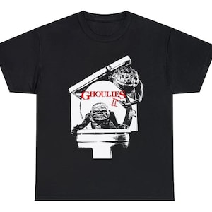 May include: Black t-shirt with a white graphic of two creatures from the movie "Ghoulies II" emerging from a toilet.
