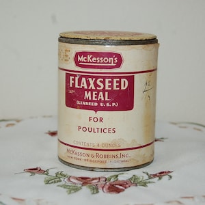 Puede incluir: Una lata de metal vintage de harina de semillas de lino McKesson's (Linseed U.S.P.) para cataplasmas. La lata es blanca con letras rojas y negras y contiene 4 onzas de harina de semillas de lino.