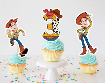 May include: Three cupcakes decorated with images of Woody from Toy Story. One cupcake has a number 3 on top, another has Woody running, and the third has Woody standing with his hands on his hips.