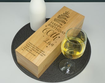 May include: A wooden box with a personalized message for a 60th birthday. The box is engraved with the text "Happy Birthday 60th Lisa" and a cake design. The message also includes "Hope you have a great time tonight. Wish we were there to raise a glass Lisa! Lots of love Will, Sheri and Josh XXX."