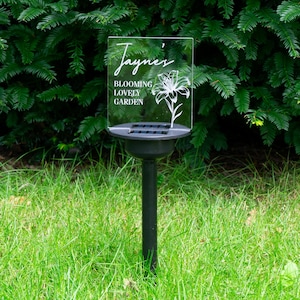 Personalised solar power garden ornament for mum. Multi colour LED outdoor name plaque. Planter and lawn decoartion