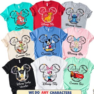 May include: A collection of colorful t-shirts featuring Disney character designs. Each shirt has a Mickey Mouse head outline with a character image, the year 2026, and customizable text. The shirts come in various colors, including teal, red, gray, and pink.