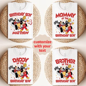 May include: White t-shirts with a cartoon graphic of Mickey Mouse in a race car. The shirts have text that says "Birthday Boy", "Mommy of the Birthday Boy", "Daddy of the Birthday Boy", and "Brother of the Birthday Boy".