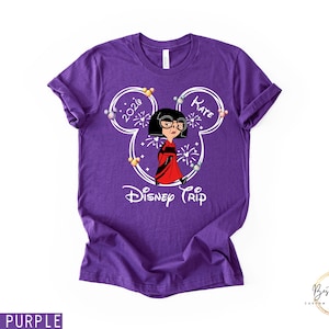 May include: A purple t-shirt featuring a cartoon character in a red dress and black glasses, inside a Mickey Mouse head outline. The text "2020" and "Kate" are inside the ears, with "Disney Trip" below the character.