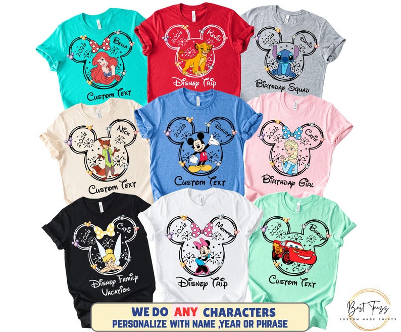 May include: A collection of colorful t-shirts featuring Disney character designs. Each shirt has a Mickey Mouse head outline with a character image, the year 2026, and customizable text. The shirts come in various colors, including teal, red, gray, and pink.