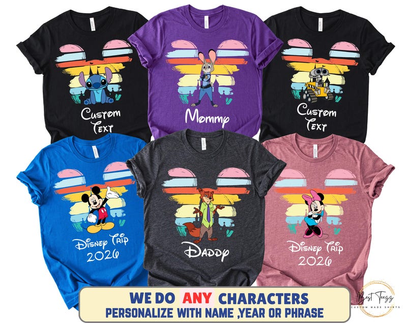 May include: A collection of six colorful t-shirts featuring Disney characters. Each shirt has a Mickey Mouse head design with a character image and text. The shirts are black, purple, blue, gray, and pink. The text includes "Custom Text", "Mommy", "Daddy", and "Disney Trip 2026".