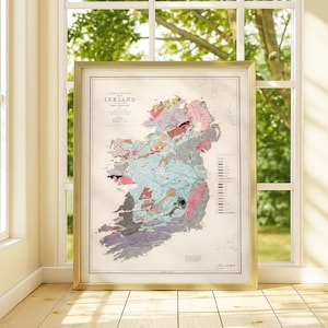 May include: Framed geological map of Ireland, featuring a detailed depiction of the island's geological composition. The map uses a variety of colors to represent different rock formations and geological features. The frame is gold-colored, adding a touch of elegance.