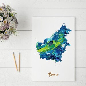 May include: A blue and green abstract painting of the island of Borneo. The painting is on a white background with the word "Borneo" written in brown text below the painting.