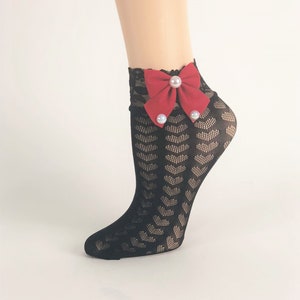 May include: Black lace ankle socks with a red bow and pearl embellishments.