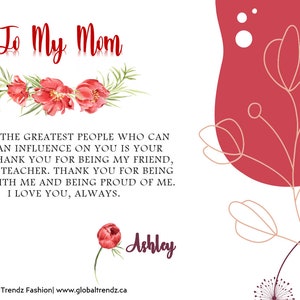 May include: A card with a floral design and the text "To My Mom" in red. The card has a message about the importance of a mother's influence and expresses gratitude for her support. The card is signed "Ashley".