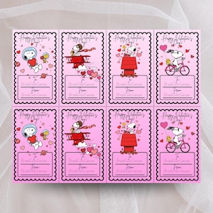 May include: Pink Valentine's Day gift tags featuring Snoopy in various scenes, including an astronaut, a biplane, on top of his doghouse, and riding a bicycle. Each tag has the text "Happy Valentine's Day!" and space for a "To" and "From" message.