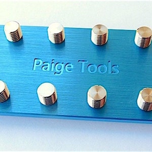 Machined from a thick aluminum plate with stainless steel studs. Made to attach all Paige Tools & Meco Midget Tips. Anodized Blue.