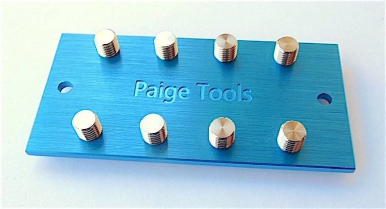 Machined from a thick aluminum plate with stainless steel studs. Made to attach all Paige Tools & Meco Midget Tips. Anodized Blue.