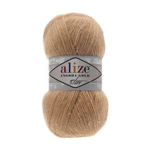 May include: A skein of beige yarn with silver glitter, labeled "alize Angora Gold Star"