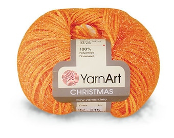 May include: A skein of orange yarn with a label that reads "YarnArt Christmas 100% Polyamide 142 m/142 m/ 155 yds www.yarnart.info Color 32 015".