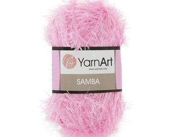 May include: A pink yarn ball with a label that reads "YarnArt" and "SAMBA".