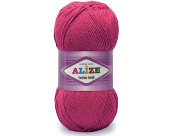 May include: A ball of pink cotton yarn with a label that reads "cotton club ALIZE Cotton Gold"