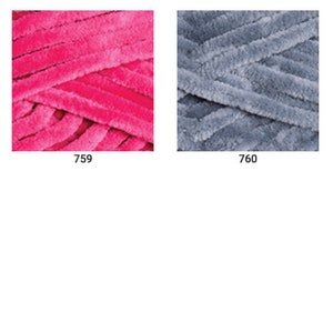 May include: Five skeins of yarn in different colors: turquoise, pink, gray, peach, and blue. The yarn is a fuzzy, chenille-like texture.