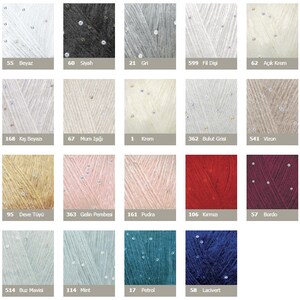May include: A color chart of yarn with sequins. The yarn colors include white, black, gray, cream, beige, pink, red, burgundy, blue, and green. The yarn is labeled with numbers and names in Turkish.