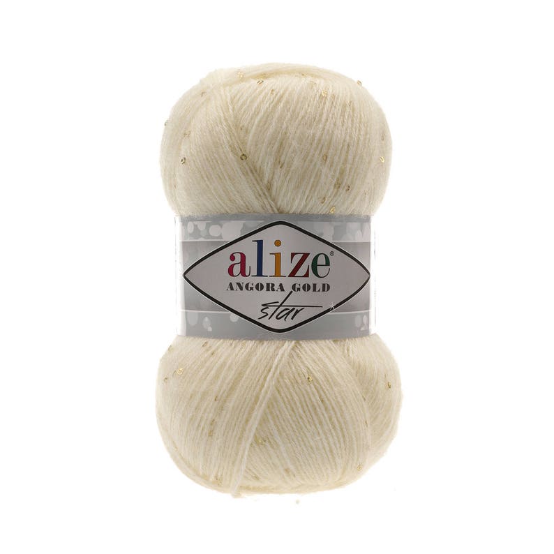 May include: A skein of Alize Angora Gold Star yarn in a cream color with gold glitter. The yarn is wrapped around a cardboard tube with a label that reads "Alize Angora Gold Star".