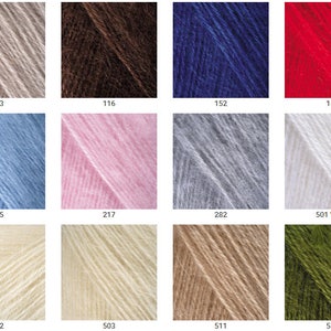 May include: A collection of yarn skeins in various colors, including beige, brown, blue, red, light blue, pink, gray, white, cream, and green. The skeins are labeled with numbers, including 033, 116, 152, 156, 215, 217, 282, 501 White, 502, 503, 511, and 530.