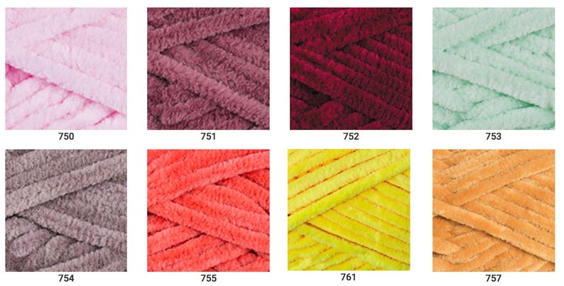 May include: A collection of yarn skeins in various colors, including pink, red, orange, yellow, green, brown, and gray. The yarn is soft and fluffy, and it is perfect for knitting or crocheting.