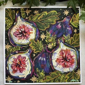 May include: A print of a painting featuring four purple and blue figs with pink and white interiors. The figs are surrounded by green leaves and gold stars on a dark green background.