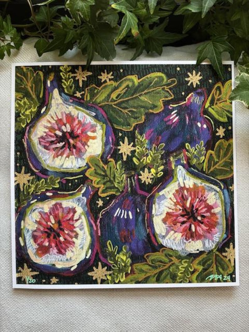 May include: A print of a painting featuring four purple and blue figs with pink and white interiors. The figs are surrounded by green leaves and gold stars on a dark green background.