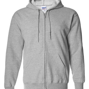 May include: A light gray zip-up hoodie with a drawstring hood and a front pocket. The hoodie has a full-length zipper and ribbed cuffs and hem. The brand name "Gildan" is visible on the label. This casual sweatshirt is suitable for everyday wear.