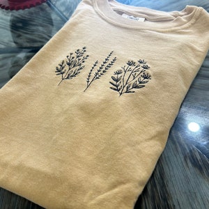 Floral embroidered t-shirt
comfort colors tshirt with embroidery
wild flower embroidery tshirts