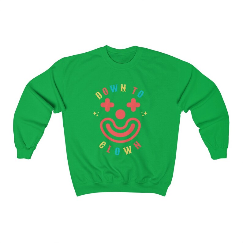 May include: Green sweatshirt with a colorful graphic of a clown face and the text "DOWN TO CLOWN".