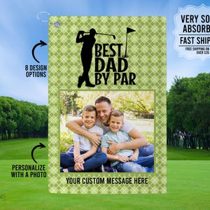 May include: Green and white golf towel with a photo of a family of three. The towel has the text "Best Dad By Par" and a silhouette of a golfer.