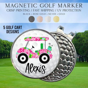 May include: A round magnetic golf marker featuring a white golf ball texture background with a pink and green floral patterned golf cart graphic and the name Alexis printed in black script. The marker has a metallic silver textured base.