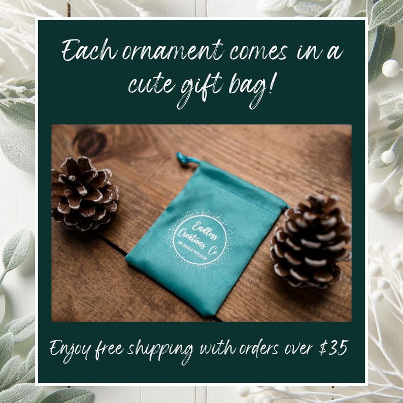 May include: A teal drawstring gift bag with the text "Endless Creations Co" sits on a wooden surface, flanked by two pinecones. The text "Each ornament comes in a cute gift bag!" is above the bag.