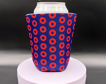 May include: A blue and red neoprene can cooler with a donut pattern. The cooler is designed to fit a standard 12-ounce can.
